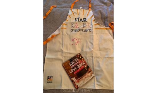 Star baker apron and book both signed by Paul Hollywood